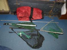 A small quantity of fishing nets including Keenets, Cormoran etc , all in a red rod carrier bag.
