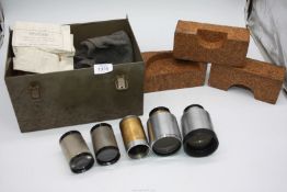 A metal box containing various Projection Lenses including two Kershaw and Sons Gaumont - Kalee