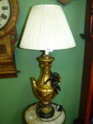A decorative French gilt metal table lamp,