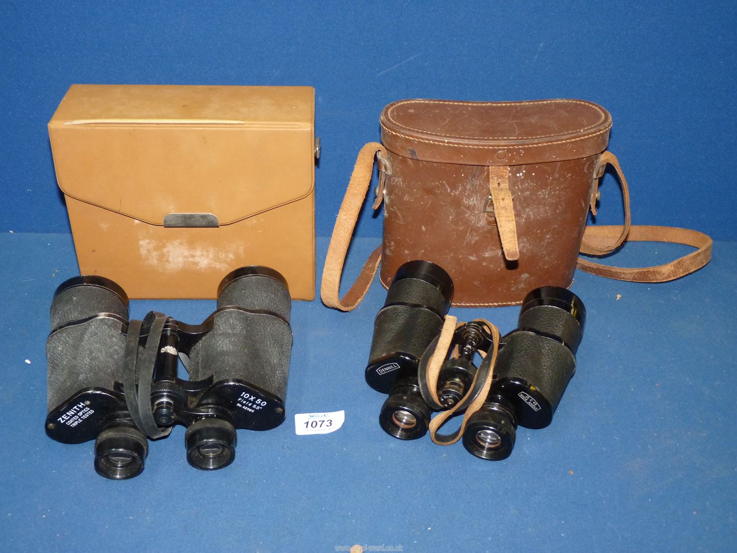 A leather cased pair of binoculars by 'Denhill' 15 x 45 wide angle and a pair of Zenith triple