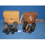 A leather cased pair of binoculars by 'Denhill' 15 x 45 wide angle and a pair of Zenith triple