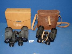 A leather cased pair of binoculars by 'Denhill' 15 x 45 wide angle and a pair of Zenith triple