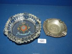 A white metal ashtray with inscription in German translated to 'Offered in gratitude on behalf of