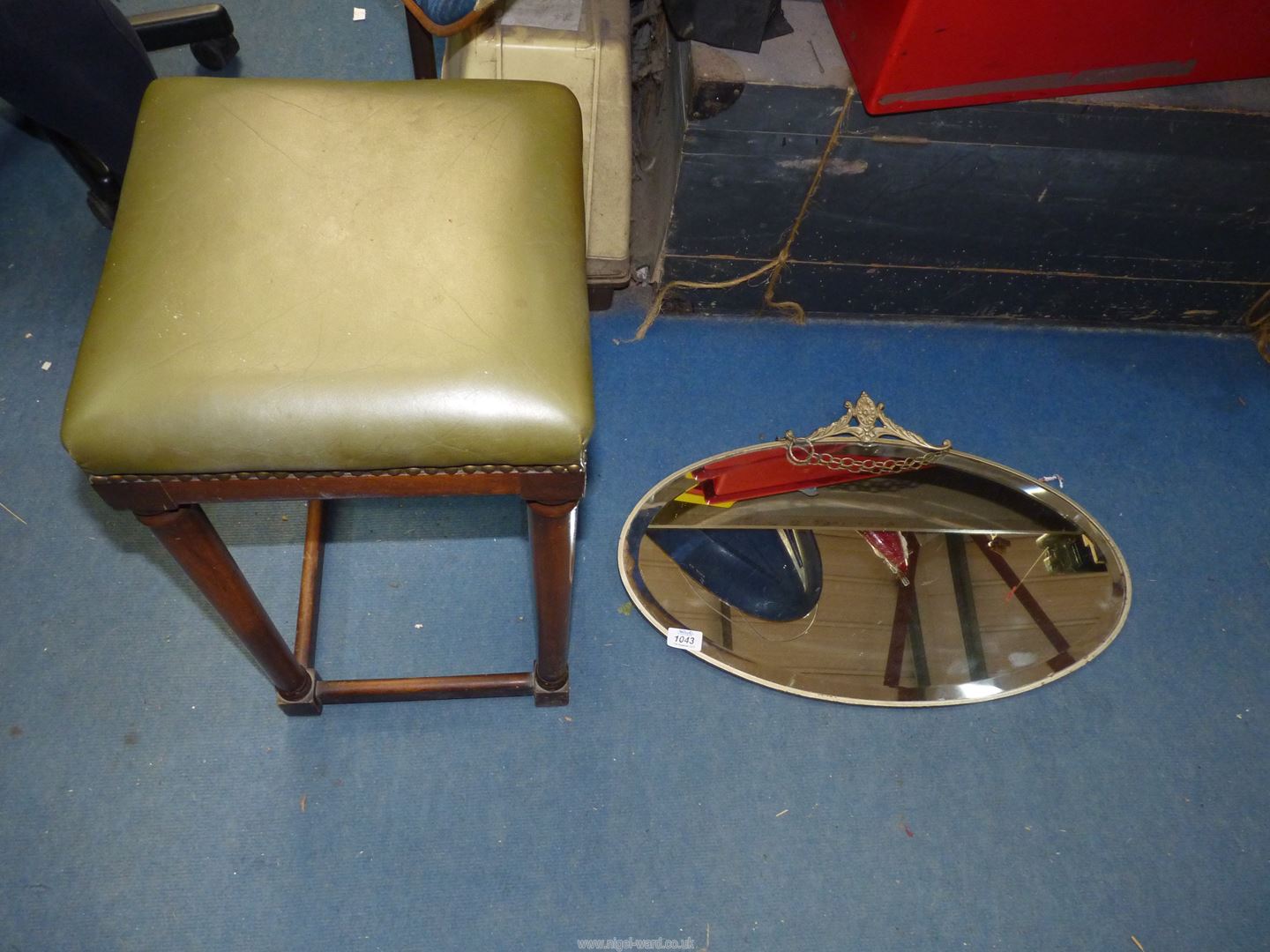 An early 20th century Mahogany framed stool standing on circular legs united by stretchers with