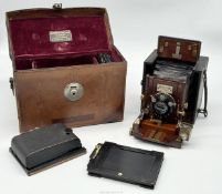 A James A Sinclair Una Quarter Plate Camera in fitted case with roll film back and three plate