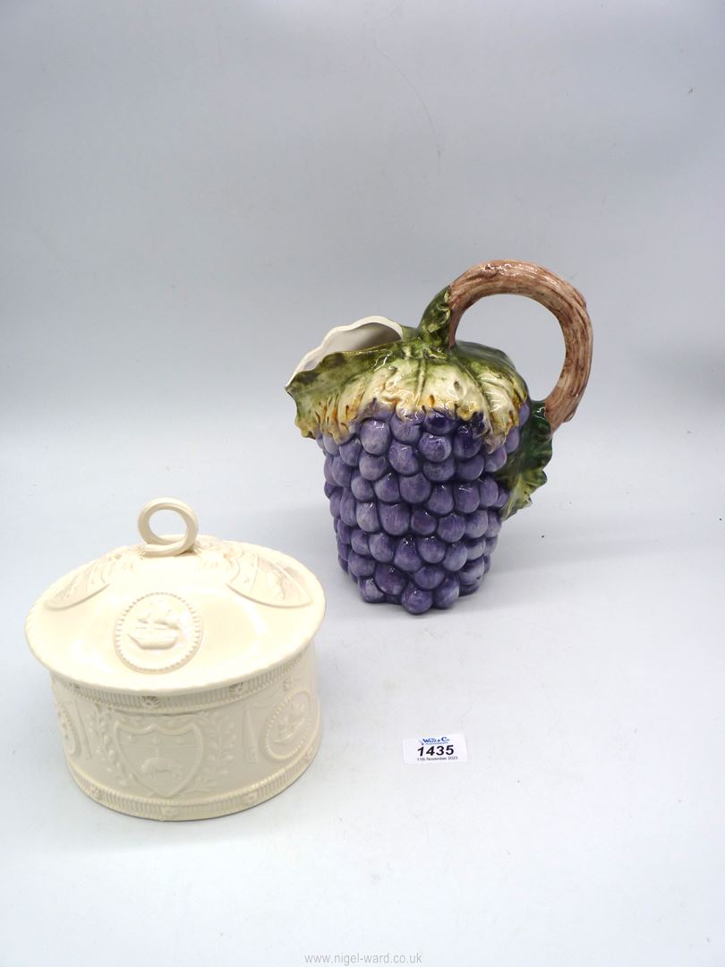 A large Italian Majolica Bassano wine jug in shape of grapes and vine, 10" tall (chip to leaf),