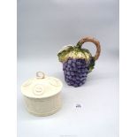 A large Italian Majolica Bassano wine jug in shape of grapes and vine, 10" tall (chip to leaf),