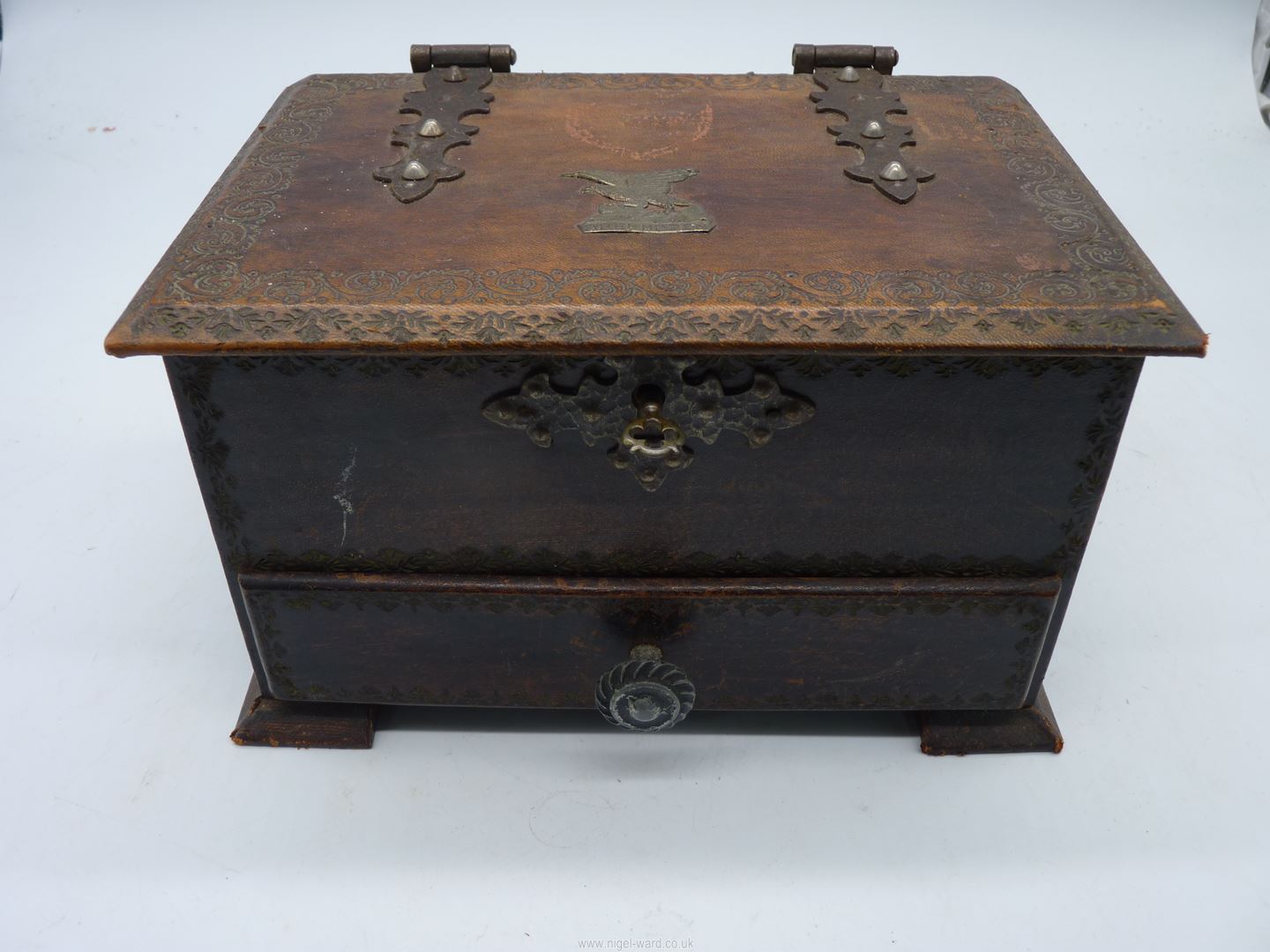 An embossed leather covered Jewellery Box with metal hinges and handles,