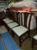 A set of four Georgian type Mahogany Dining Chairs having fretworked splats and drop-in seat.