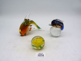 A small quantity of paperweights including two with Dolphin and one with yellow flower.