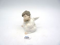 A Lladro figure of Cherub sleeping.