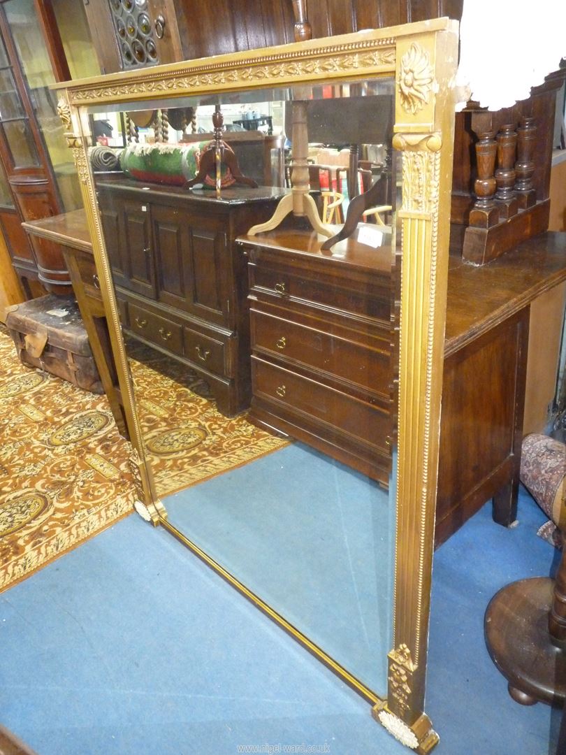 An elegant bevelled mirrored Overmantel Mirror having a solid gold coloured finished frame with