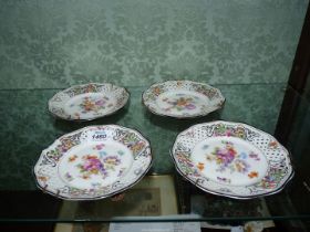 Four Schumann Dresden Pierced porcelain dishes, floral decoration, two damaged, circa 1930.