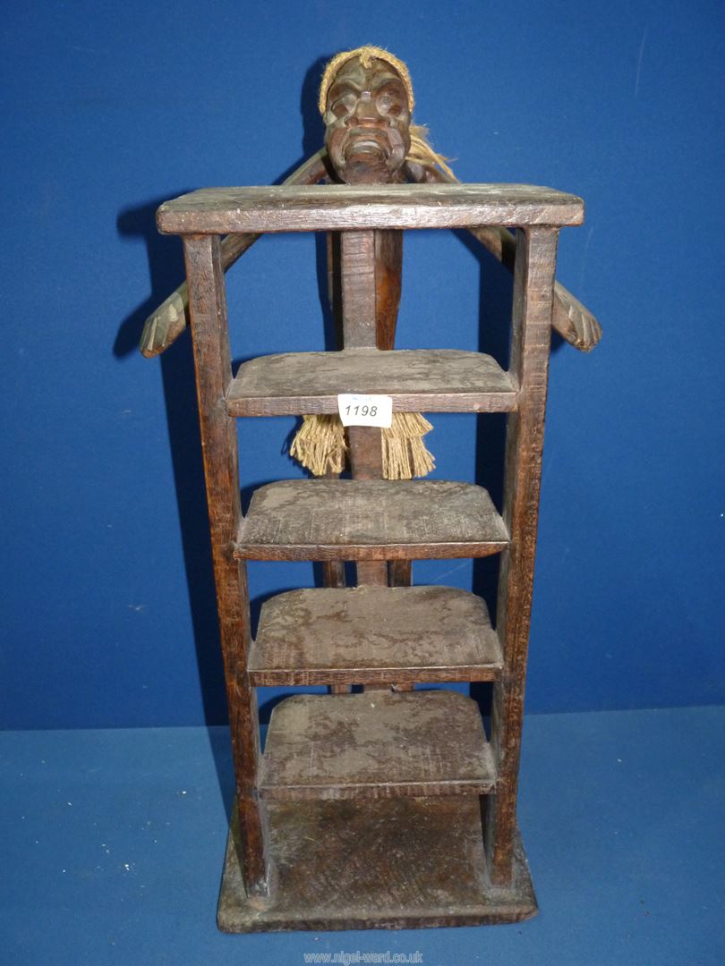 A small set of CD storage shelves with ethnic carving to the top, 28'' tall. - Image 2 of 2