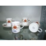 Four Susie Cooper 'Marisposa' coffee cans and saucers.