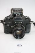 A Fujica ST901 35mm SLR Camera with a Fujinon 55mm f/1.8 lens and ever ready case, as found.