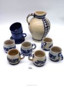 A large Bavarian stoneware, salt glazed jug with four matching mugs,