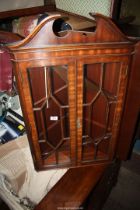 A Mahogany wall hanging corner display cabinet having a pair of opposing seven pane glazed doors