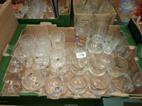 A quantity of glasses to include; six Babycham, six Tia Maria,