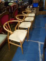A set of four very stylish Danish/Scandinavian bow backed Dining Chairs having Ash wood frames and