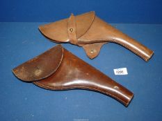 Two brown leather Military holsters.