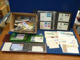 A quantity of First Day Covers, loose and in albums to include Japan, United States, Germany,