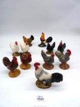 A quantity of 'Quail Ceramics' salt & pepper pots in the form of chickens including black, white,