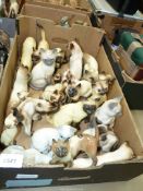 A quantity of china Siamese cat ornaments including Babbacombe Pottery, Tretham Artware, etc.
