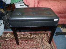 A contemporary black/ebony coloured piano stool,