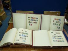 A set of four Newage stamp albums and contents of Great Britain and Commonwealth stamps 1936 - 52,
