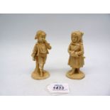 A pair of Royal Rydolstadt 19th century figures of children carrying wood in winter in a light salt