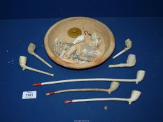 A small quantity of clay pipes including in the form of an eagles claw, part of an animal skull etc.