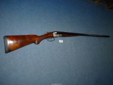A double barrelled side by side 16 bore box-lock shotgun by German makers J.P.