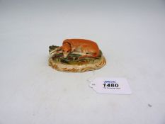 A 19th c. Staffordshire Greyhound/Whippet on green base, 4 1/2'' wide x 3'' deep.