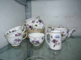 A Hammersley 'Victorian Violets' part tea set consisting of teapot, five cups and six saucers,