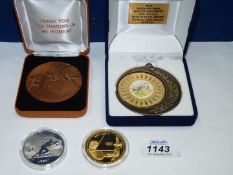 A cased Beijing 2002 commemorative Coin, a cased Archery commemorative Coin,