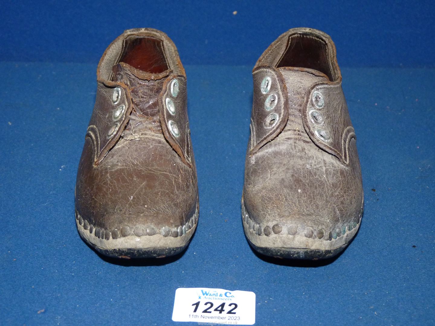 A pair of children's leather Lancashire clogs, possibly Victorian.