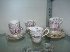 A bone china rose pattern and gilt part tea set to include; six cups (one a/f.