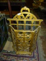 A gold painted cast iron Stick/umbrella Stand decorated with floral swags, foliage, etc.