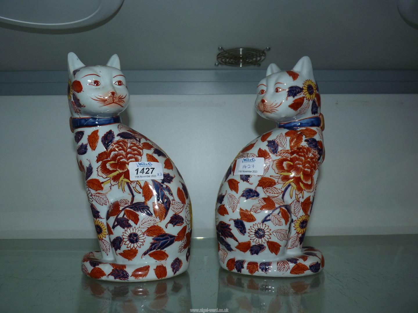 A pair of Imari cats, 10" tall (hairline crack to one).