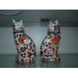 A pair of Imari cats, 10" tall (hairline crack to one).