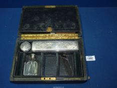 A ladies travel box having some of the original contents, made by 'H.