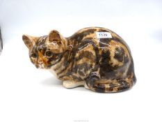 A Winstanley cat in crouched position, signed to base, size 5, 11" long x 5 3/4" high.