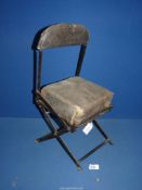 A Hawke leather and metal folding seat, model A.