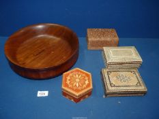 A large wooden fruit bowl, 12" diameter x 3 1/2" high and four inlaid boxes including a spice box.