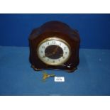 A Smiths Enfield bakelite mantle clock with pendulum and key, 8 1/2" x 7 1/2".