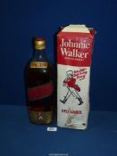 A boxed, (approx. 1970's) Johnnie Walker Red Label, four pint bottle of scotch whisky.