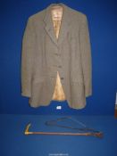 A Fytchley hacking jacket, size small (some stains to lining) plus a riding crop.