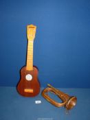 A 19th century well used brass and copper bugle stamped England and a Clifton Sopran Ukulele.