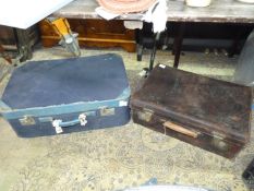 An old blue suitcase and brown leather suitcase belonging to Guy Montague Butler,